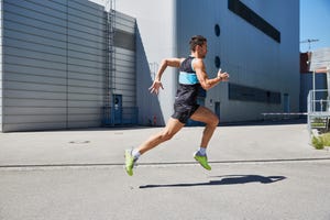 fit man running along building