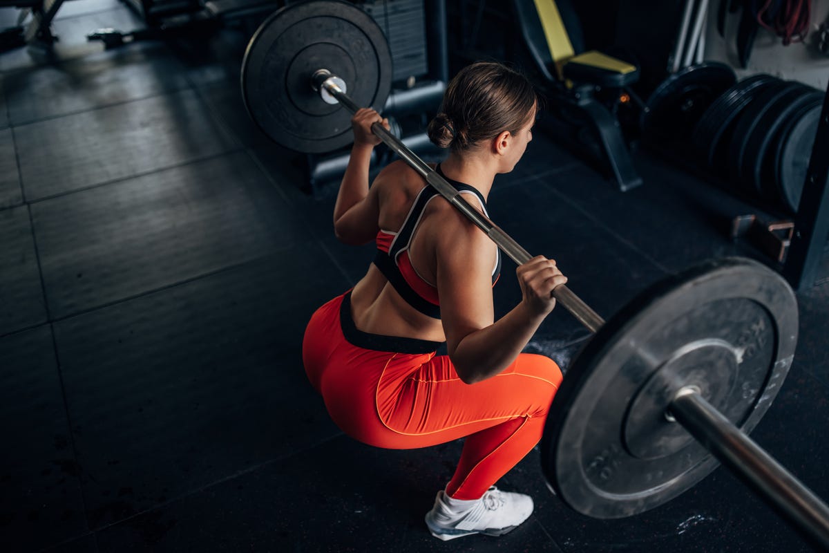 Master The Barbell Back Squat With This Golf Club Hack