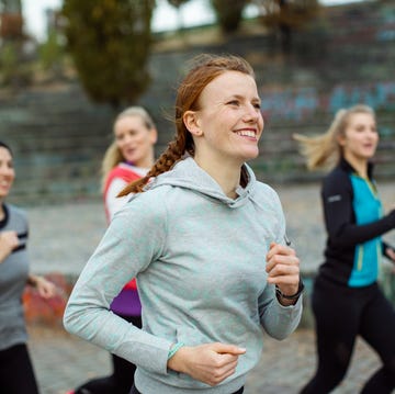 Fit woman with friends jogging in park fit woman with friends jogging in park
