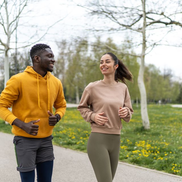 fit young couple running in the park