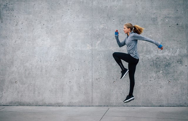 fit young woman doing cardio interval training