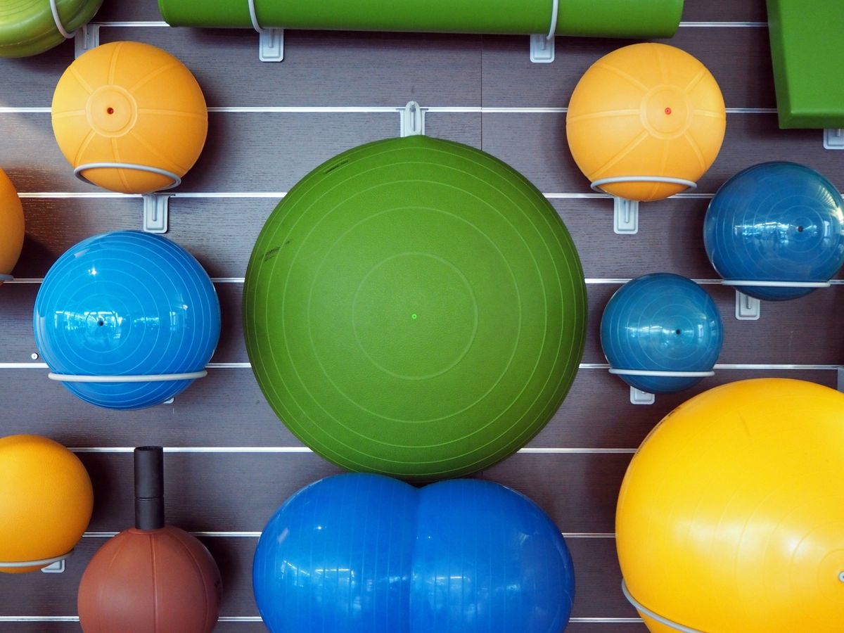 fitness balls arranged in gym