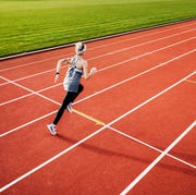 interval workouts on outdoor track fitness enthusiast running on outdoor track