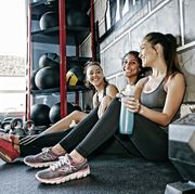 women resting together in gym