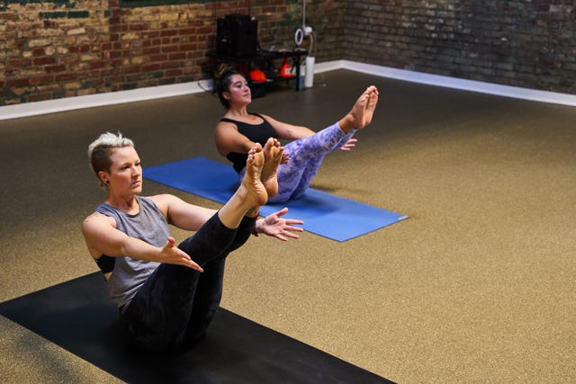 two people doing yoga