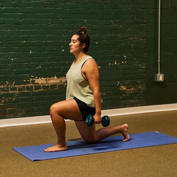 woman doing weighted lunges in a gym woman doing weighted lunges in a gym