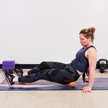 a person doing a trigger point exercise a person doing a trigger point exercise