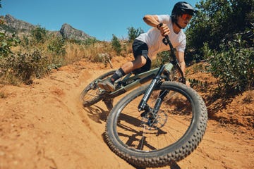 fitness, speed and extreme sports with man on mountain bike for adventure, cycling and adrenaline junkie exercise, risk and fast with male athlete in nature for workout, training and action