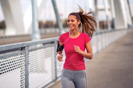 fitness woman jogging outdoors on bridge