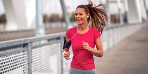 fitness woman jogging outdoors on bridge