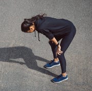 Fitness woman she is running the road Tired and hot from the sun fitness woman she is running the road tired and hot from the sun