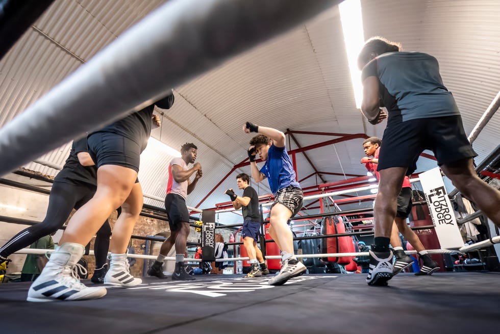 Group boxing training session in a gym