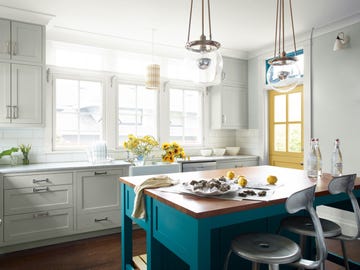 a kitchen with white cabinets