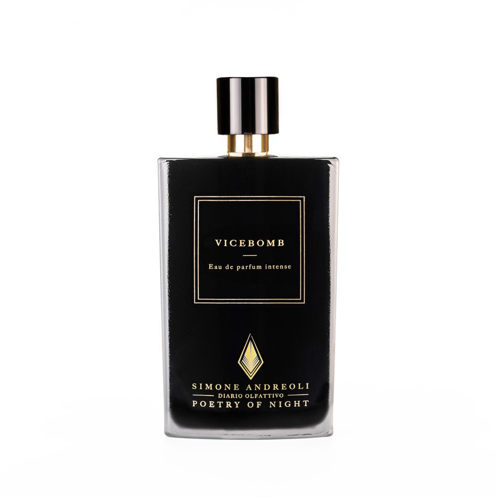 a black and gold perfume bottle