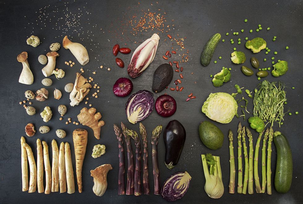 flat lay of various fresh vegetables on black table