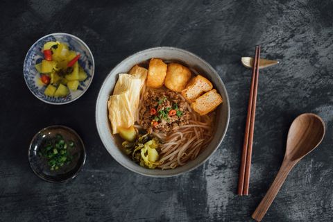 flat lay shot of asian noodle soup served on the table