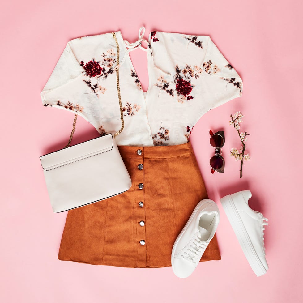 flat lay shot of female holiday clothing and accessories