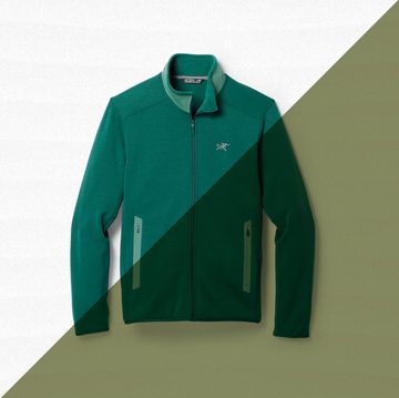 a green jacket on a white surface