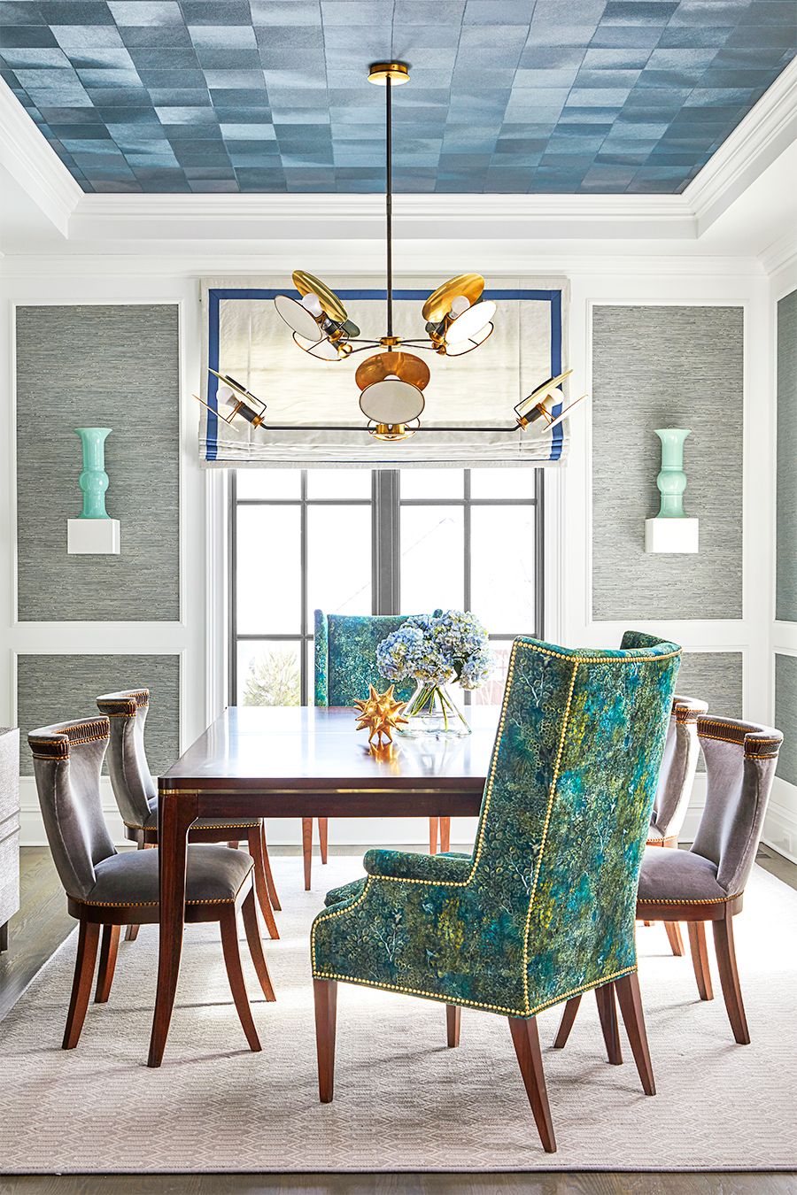 dining room with green accent chairs