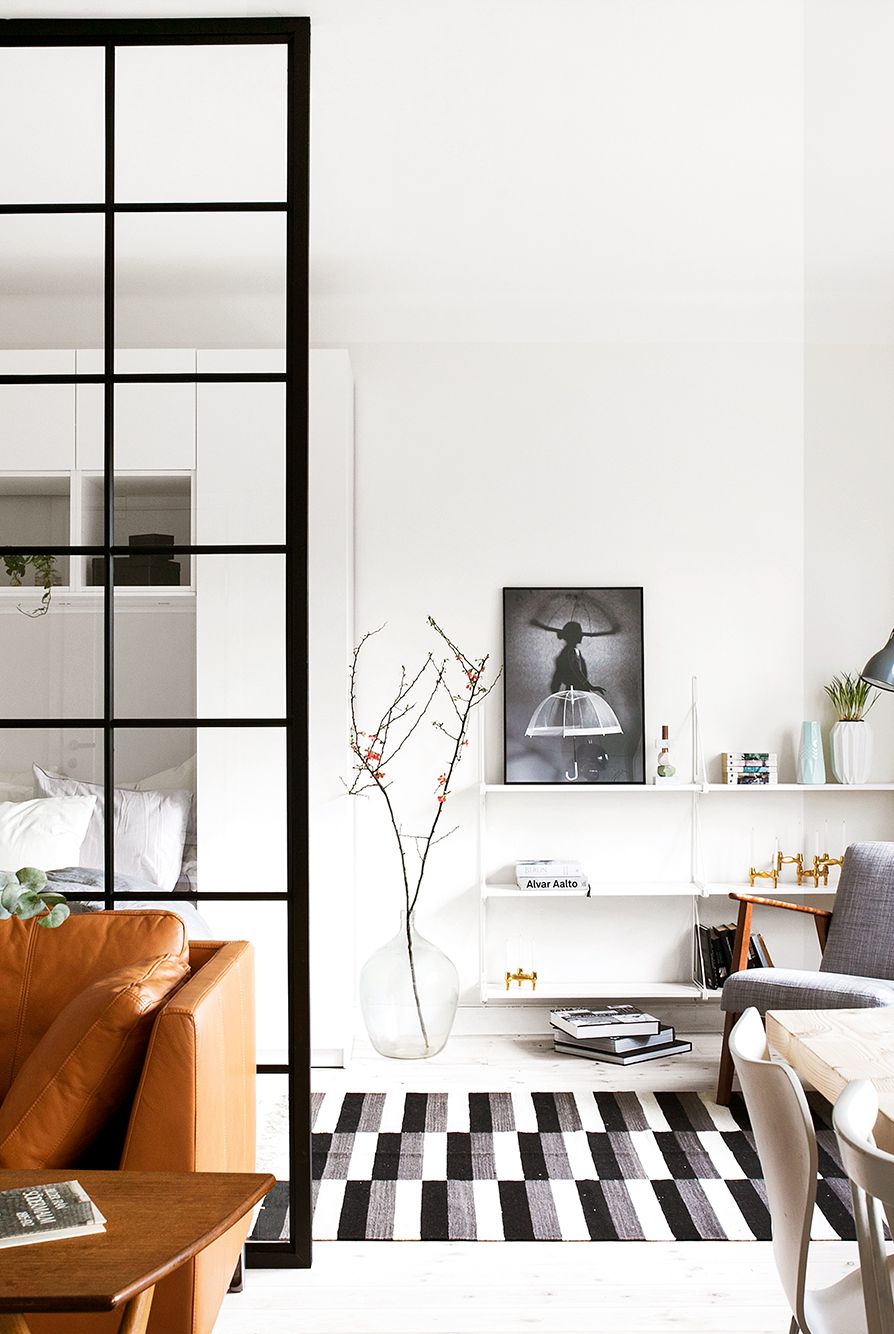 scandinavian style studio apartment with floating shelves