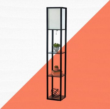black floor lamp with shelves against orange and white background