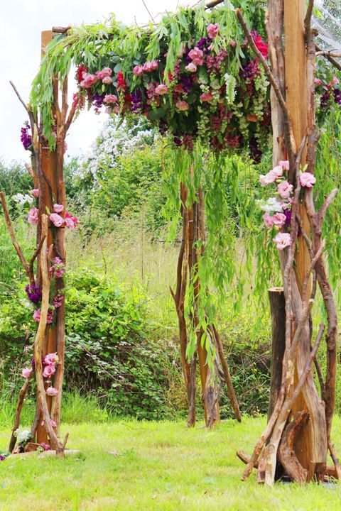 floral chuppah in backyard wedding