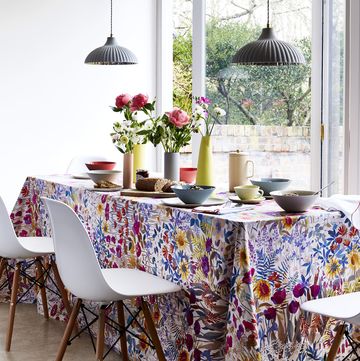 dining room overlooking window with floral pattern tablecloth