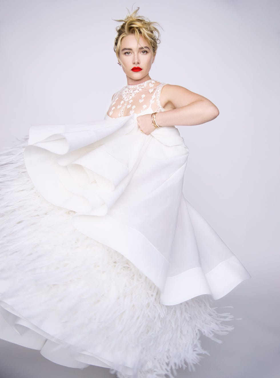tulle top; feather skirt, from a selection, both giambattista valli. rose gold and diamond ear cuff; matching earrings; rose gold bangle,; gold and diamond bangle, from a selection; gold, pearl and diamond ring (just seen), all tiffany & co