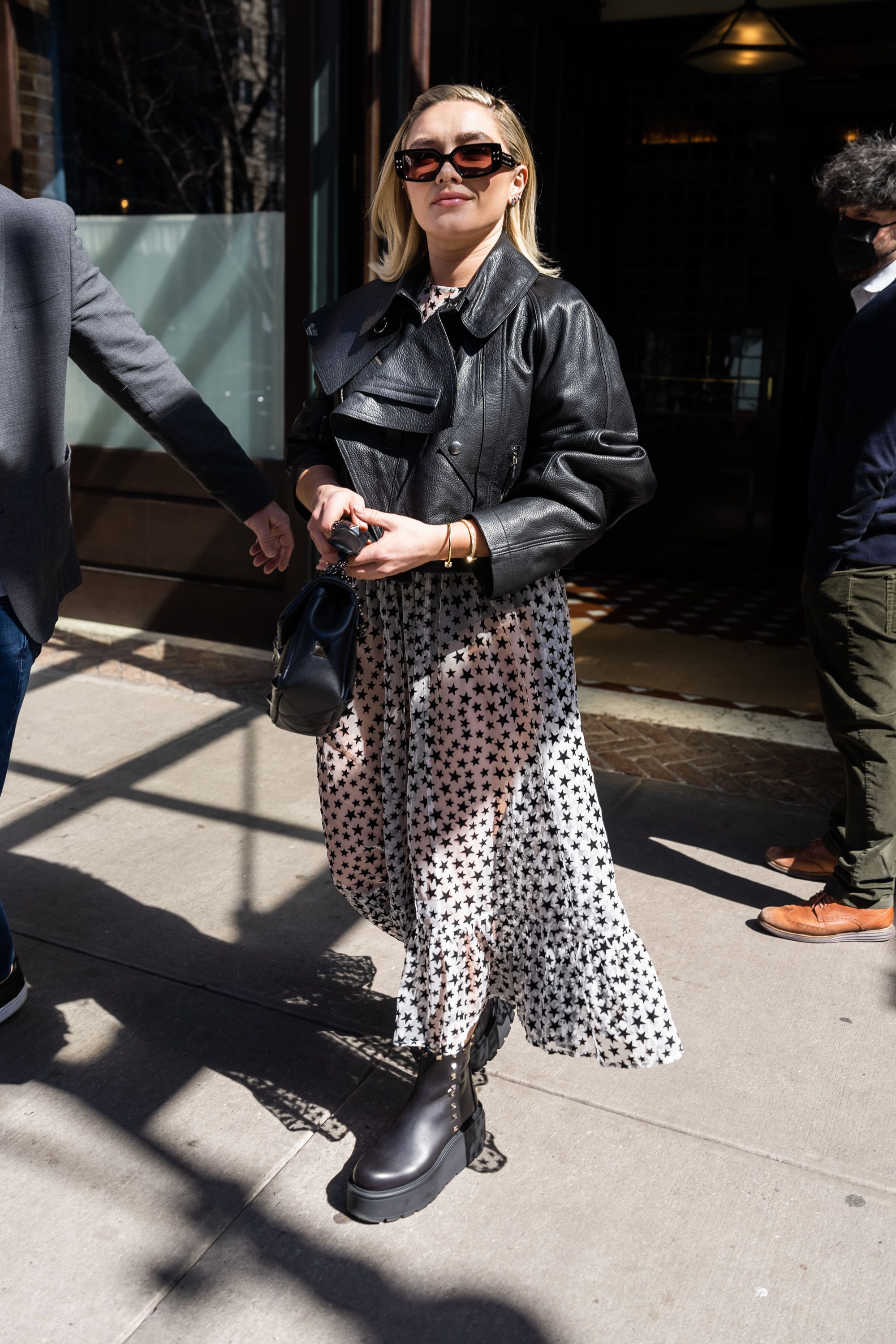 Florence Pugh wears an underboob-baring shirt and tie