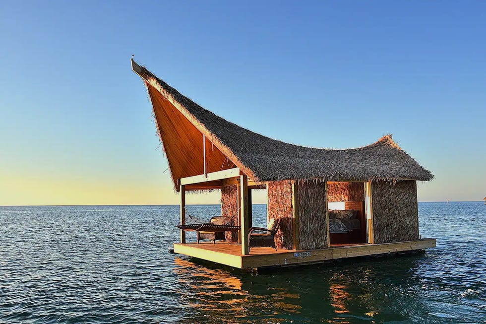 a house on a dock in the water