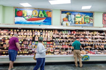 florida, miami beach, trader joe's, grocery store refrigerated deli and cheese section with customers