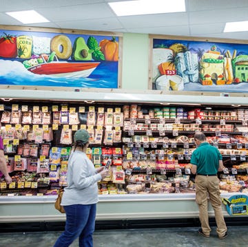 Florida, Miami Beach, Trader Joe's, grocery store refrigerated deli and cheese section with customers florida, miami beach, trader joe's, grocery store refrigerated deli and cheese section with customers