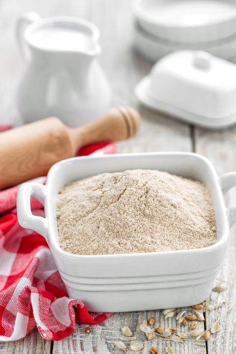 wheat flour in dish with rolling pin
