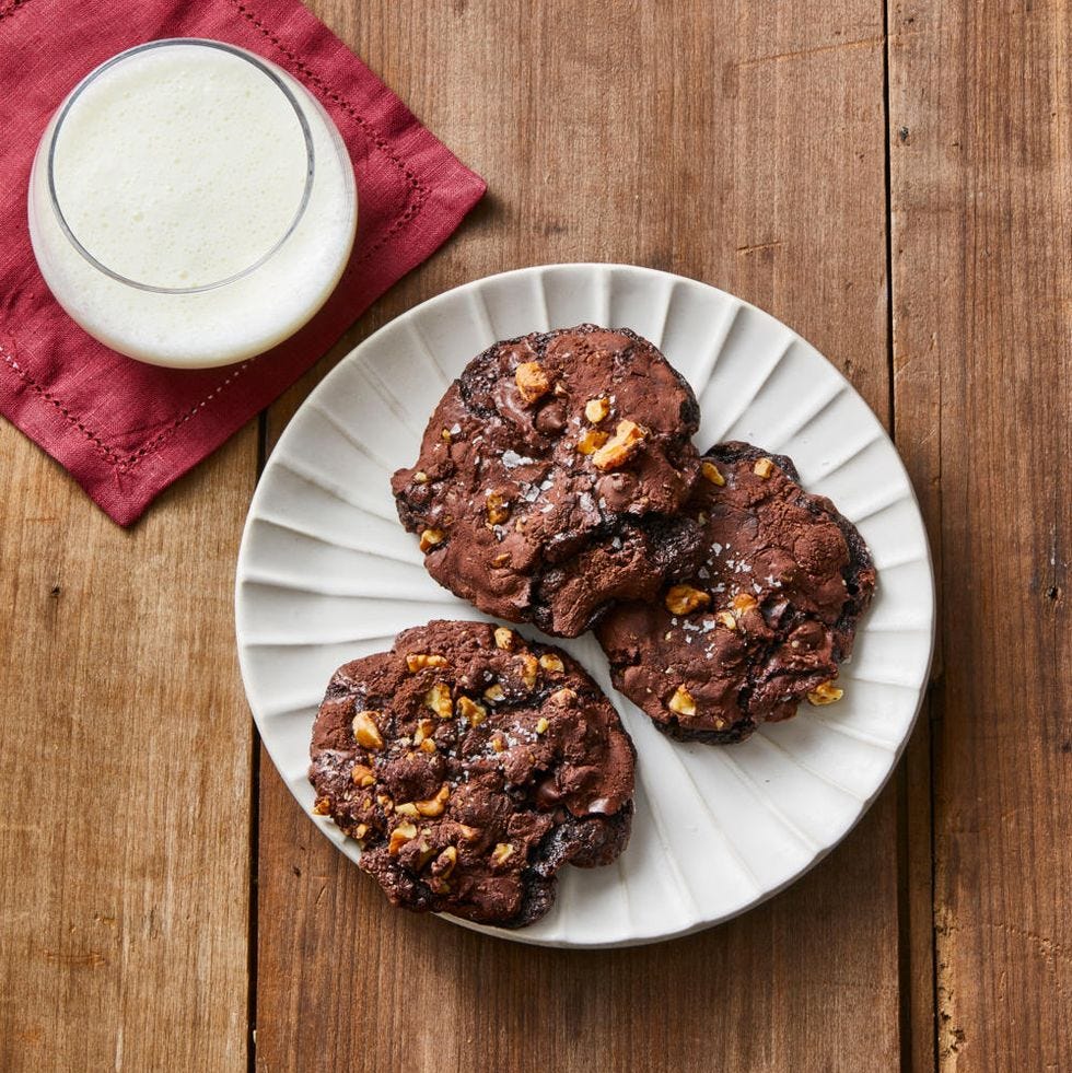 flourless chocolatewalnut cookies on white scalloped plate