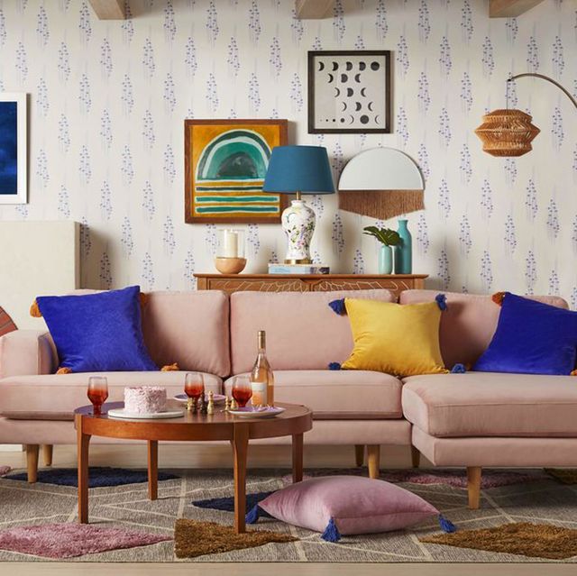 living room with pink sectional and colorful decor