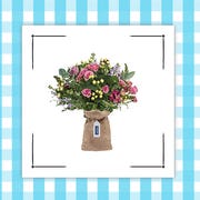 two bouquets of flowers on a blue gingham background two bouquets of flowers on a blue gingham background