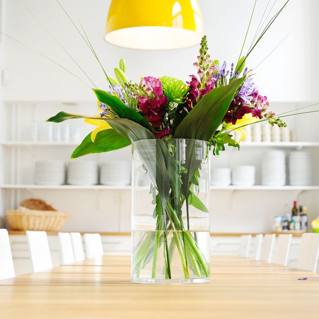 Flowers on table in bright large kitchen