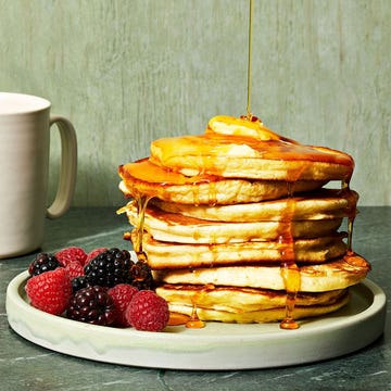 Fluffy Pancakes fluffy pancakes with syrup drizzled on top