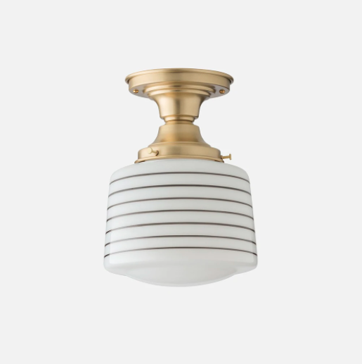 vintage style flush mount light with gold hardware and striped light cover