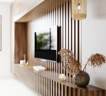 tv area in living room close up, fluted wooden panel with modern decoration