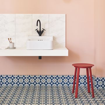 pink bathroom with blue and white tiles
