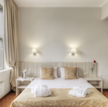 folded robes on bed in hotel room