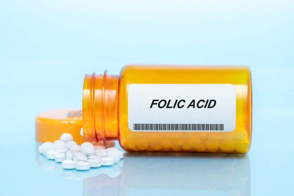 folic acid pill bottle, conceptual image