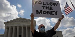 washington, dc   july 09  a man holds up a ‚Äúfollow the money‚Äù sign in front of the us supreme court july 9, 2020 in washington, dc the supreme court has issued a 7 2 ruling that new york prosecutor can obtain president donald trump‚Äôs financial records, including tax returns  photo by alex wonggetty images