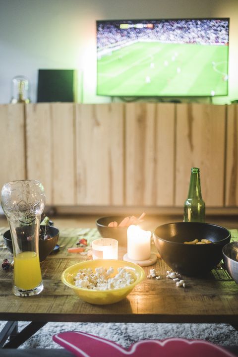 food and drink on table against tv at living room