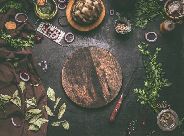 food background with empty circle wooden cutting board