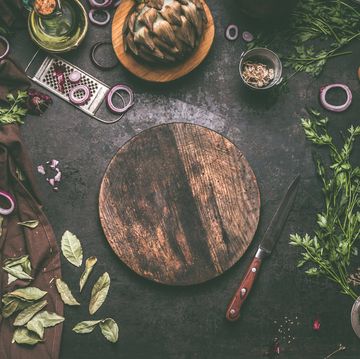 food background with empty circle wooden cutting board