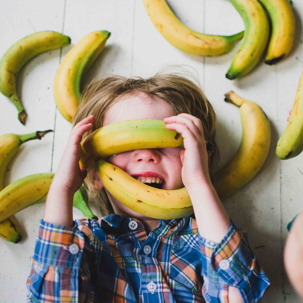 Children (2-3, 4-5) covered in bananas