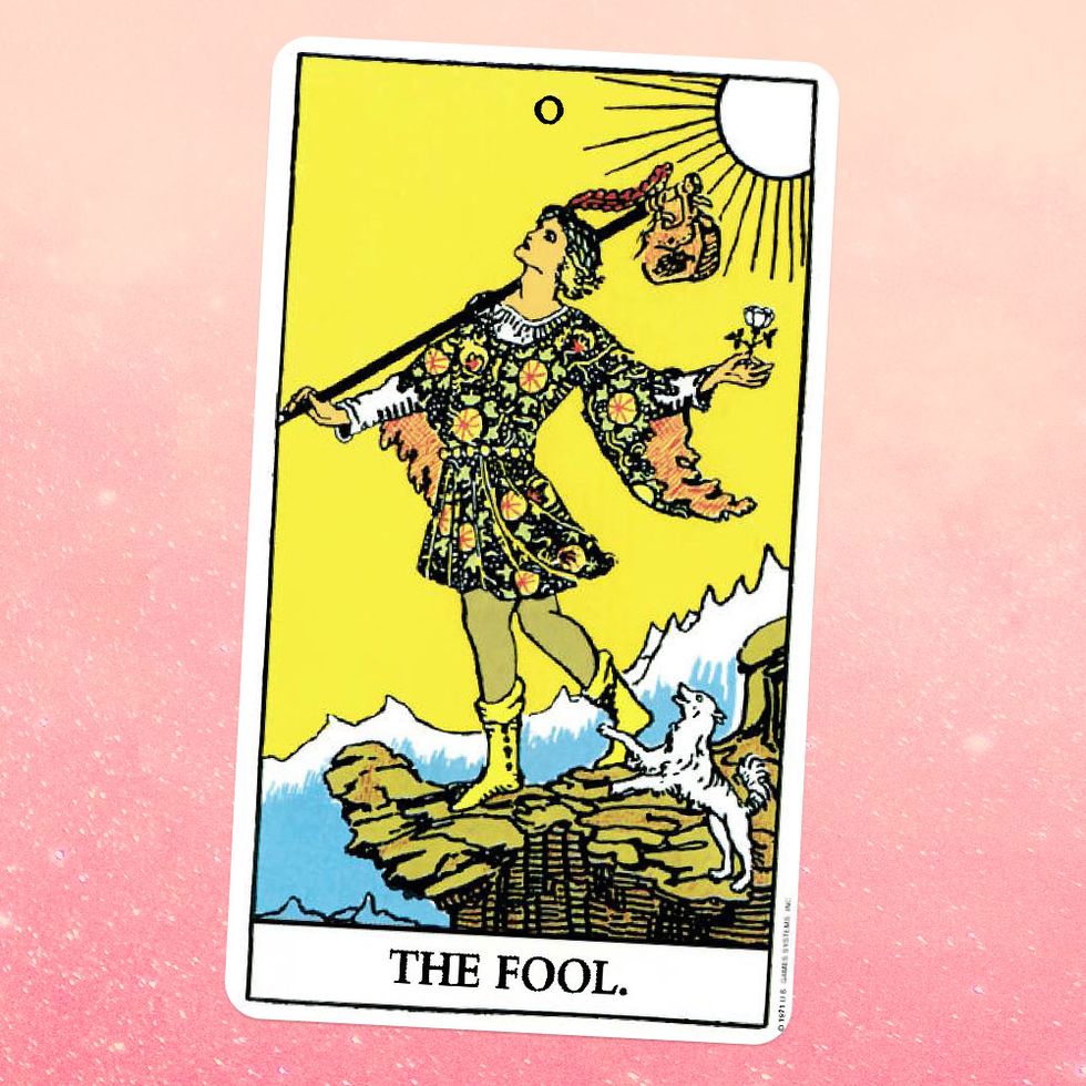the tarot card the fool, showing a person in a patterned tunic standing on a cliff, holidng a flower and a bag, the sun shining on them