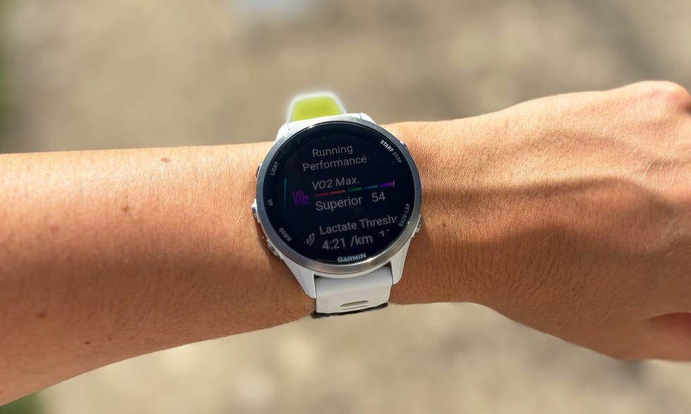 a sportwatch displaying running statistics on a wrist